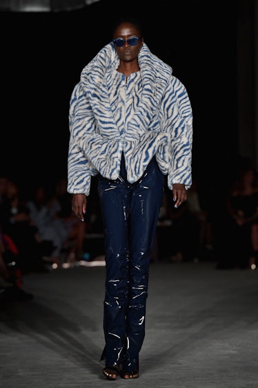 Model on the NY Fashion Week Fall 2022 runway in Christian Siriano white and blue tiger print fury j...