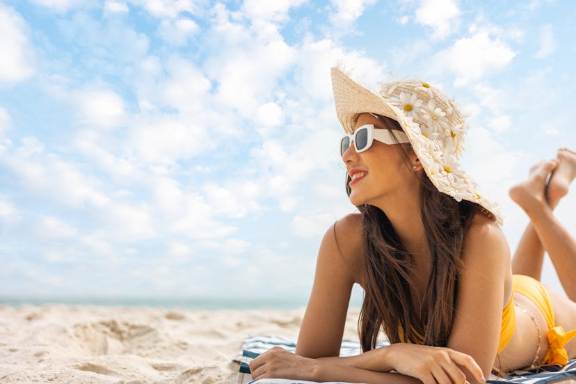 woman in sun hat and swimsuit at beach. Koh Same, Rayong ,Thailand