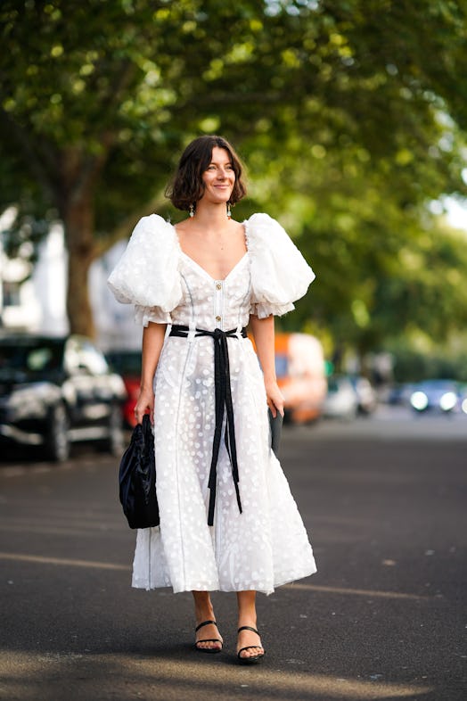 a white ruffled lace mesh dress with puff sleeves