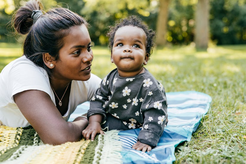 Mom enjoying outdoor time with baby daughter