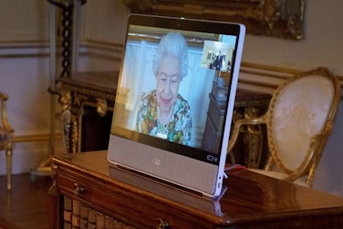 Britain's Queen Elizabeth II appears on a screen via videolink from Windsor Castle, during a virtual...
