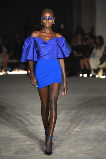 NEW YORK, NEW YORK - FEBRUARY 12: A model walks the runway wearing Christian Siriano during Christia...