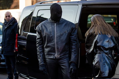 PARIS, FRANCE - JANUARY 24: Ye wearing baklava, leather jacket, leather pants, boots & Julia Fox is ...