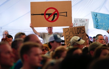 A man displays an anti gun violence sign during a March for our Lives Rally at Fairfield Hills Campu...