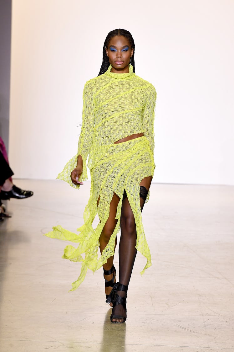 Model on the NY Fashion Week Fall 2022 runway in Kim Shui florescent green crochet dress with black ...