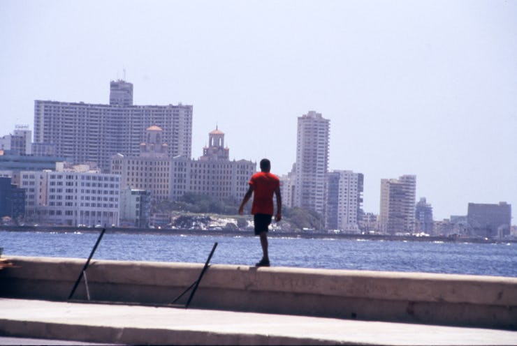 HAVANA - JUNE 1999: Cuban youth love swimming and frolicking along the El Malecon, a boardwalk, es...
