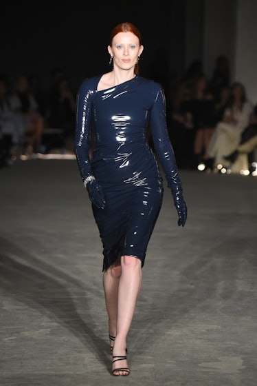 Model on the NY Fashion Week Fall 2022 runway in Christian Siriano tight blue nylon dress.