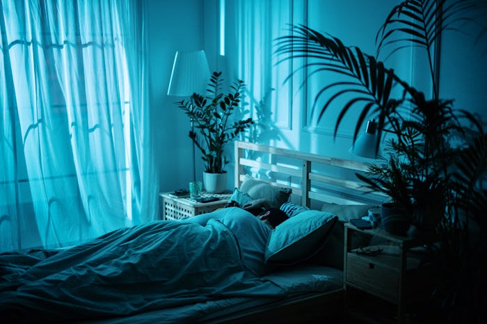 Couple cuddling together in the bed sleeping at night