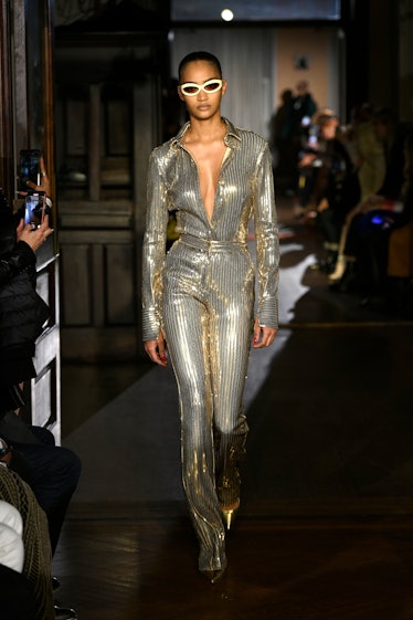 Model on the NY Fashion Week Fall 2022 runway in a LaQuan Smith silver jumpsuit