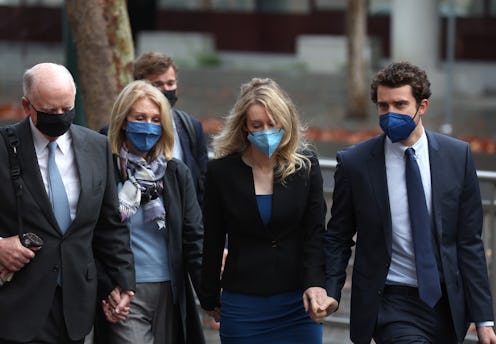 SAN JOSE, CALIFORNIA - DECEMBER 16: (L-R) Christian Holmes walks with his wife Noel Holmes, their da...