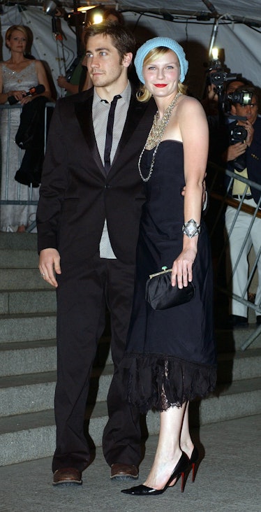 Kirsten Dunst arrives with her boyfriend Actor Jake Gyllenhaal for "Goddess: Costume Institute Benef...
