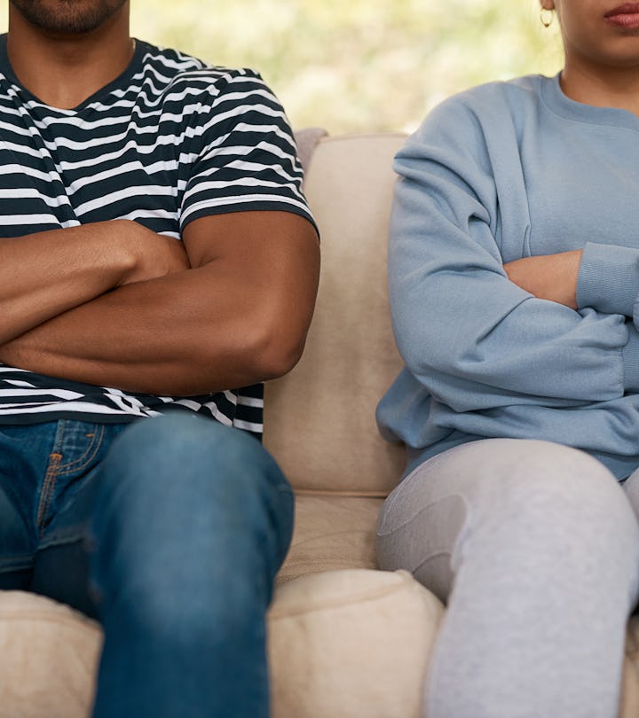 anonymous couple side by side on couch