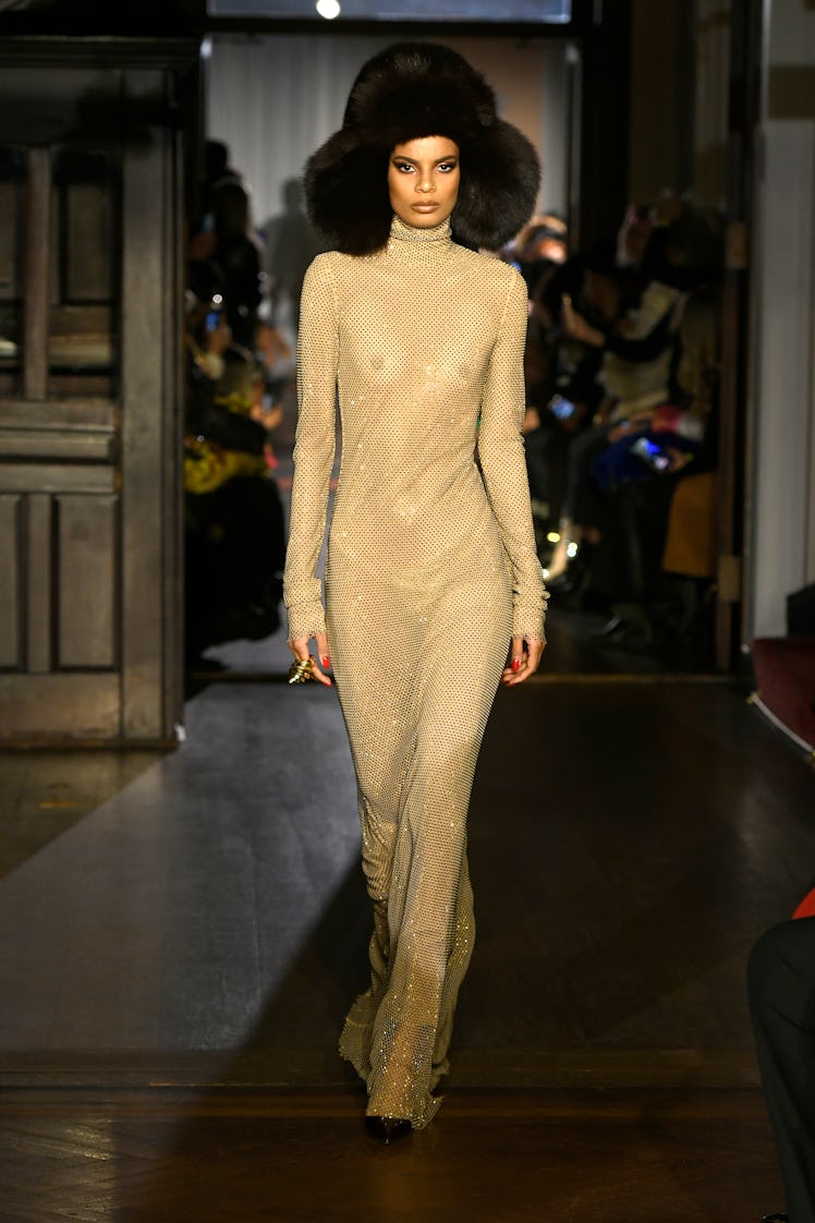 Model on the NY Fashion Week Fall 2022 runway in a LaQuan Smith beige maxi dress