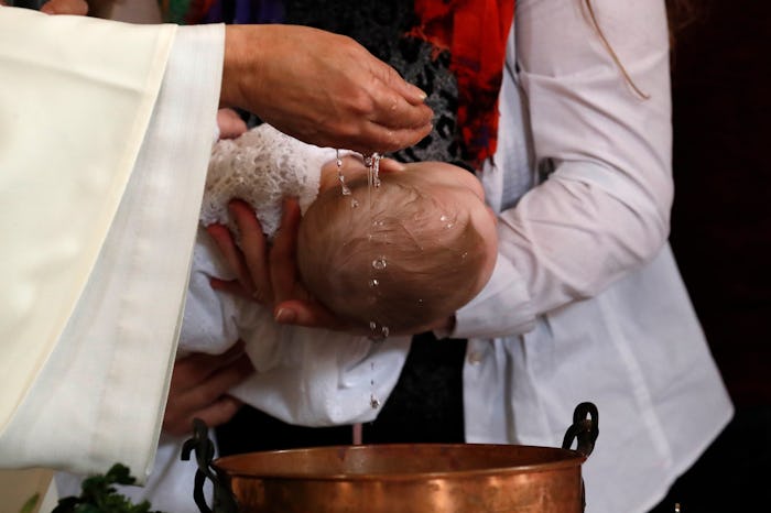 Catholic mass. Baptism. Saint-Nicolas de Veroce church. France. (Photo by: Godong/Universal Images...
