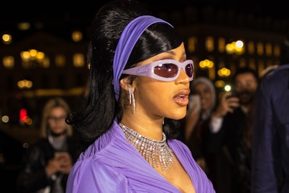 PARIS, FRANCE - OCTOBER 03: Cardi B wears a purple head band, puprle sunglasses, silver and diamond ...