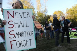 NEWTOWN, CT - OCTOBER 04:  Dozens of people attend a vigil remembering the 58 people killed in Sunda...
