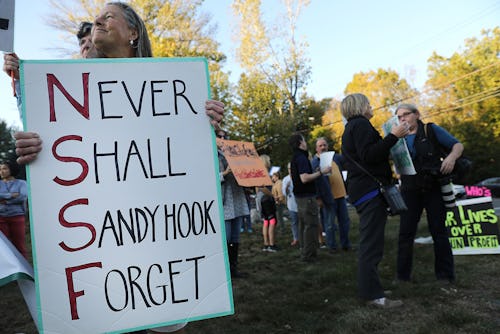 NEWTOWN, CT - OCTOBER 04: Dozens of people attend a vigil remembering the 58 people killed in Sunda...