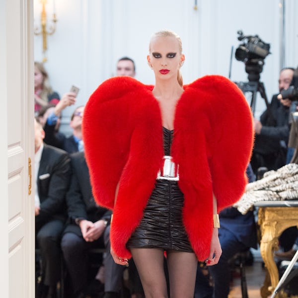 A model wearing a heart-shaped coat at Saint Laurent's Fall/Winter 2016 show during Paris Fashion We...