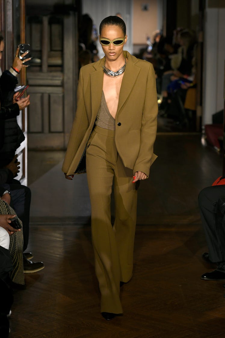 Model on the NY Fashion Week Fall 2022 runway in a LaQuan Smith brown suit