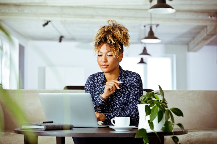 A young woman with a new job thinks of creative ways to announce your new job with new job captions.