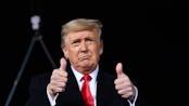 US President Donald Trump gives two thumbs up during a rally in support of Republican incumbent sena...