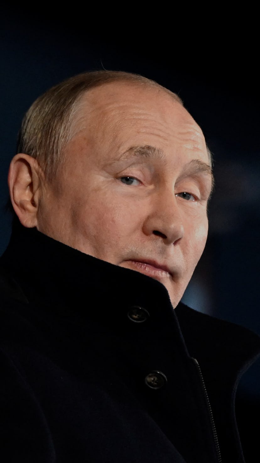 TOPSHOT - Russia's President Vladimir Putin looks on during the opening ceremony of the Beijing 2022...