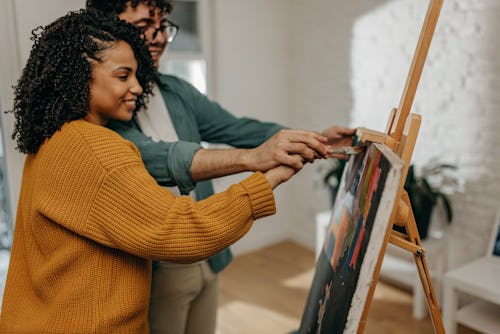 Young couple enjoying spending time together painting. Life path 6s are most compatible with life pa...