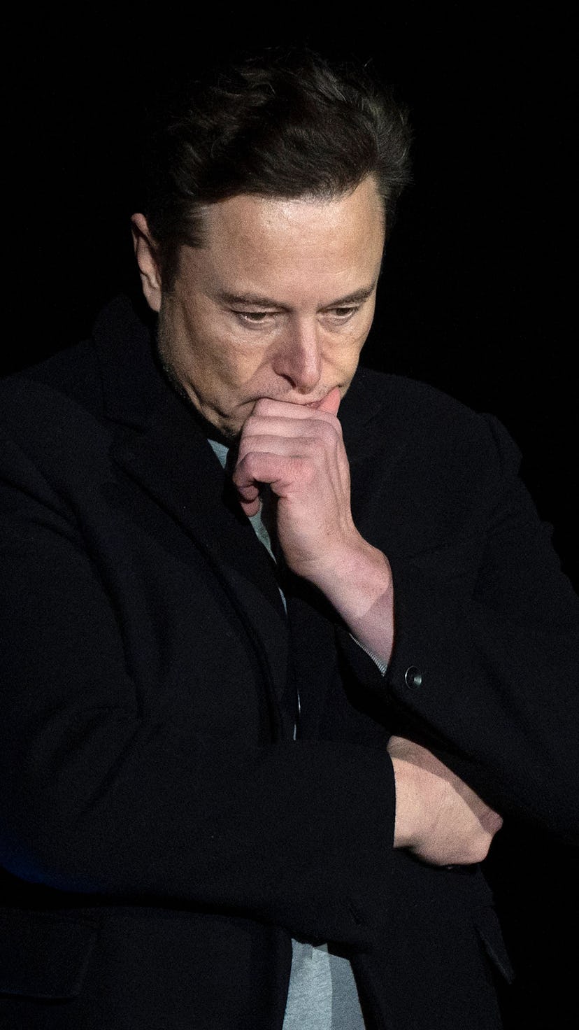 Elon Musk pauses and looks down as he speaks during a press conference at SpaceX's Starbase facility...