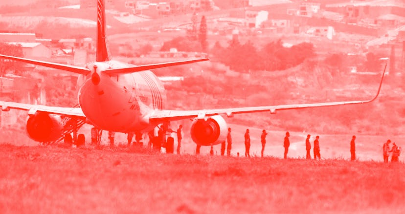 Some 136 Honduran migrants descend from a plane at the Toncontin International Airport, in Tegucigal...