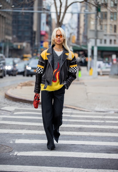 NEW YORK, NEW YORK - FEBRUARY 16: Vanessa Hong seen with edge cut hair wearing black racing leather ...