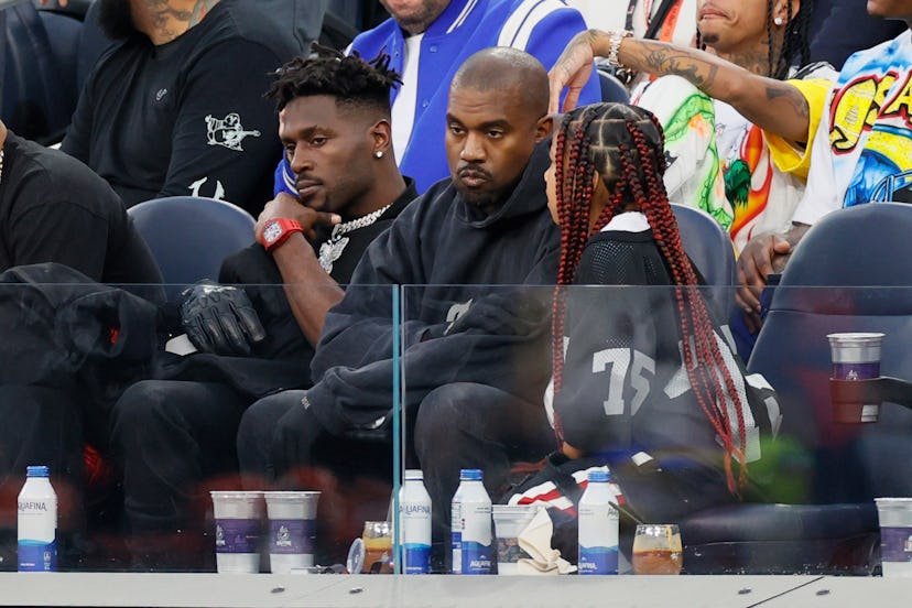 Antonio Brown, Kanye West and North West attend Super Bowl LVI on Feb. 13, 2022.