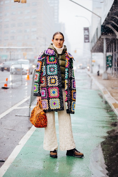 NEW YORK, NEW YORK - FEBRUARY 13: Gigi Guerra wears a colorful knit patch-style Ashish top, tan knit...