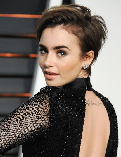 BEVERLY HILLS, CA - FEBRUARY 22:  Actress Lily Collins arrives at the 2015 Vanity Fair Oscar Party H...