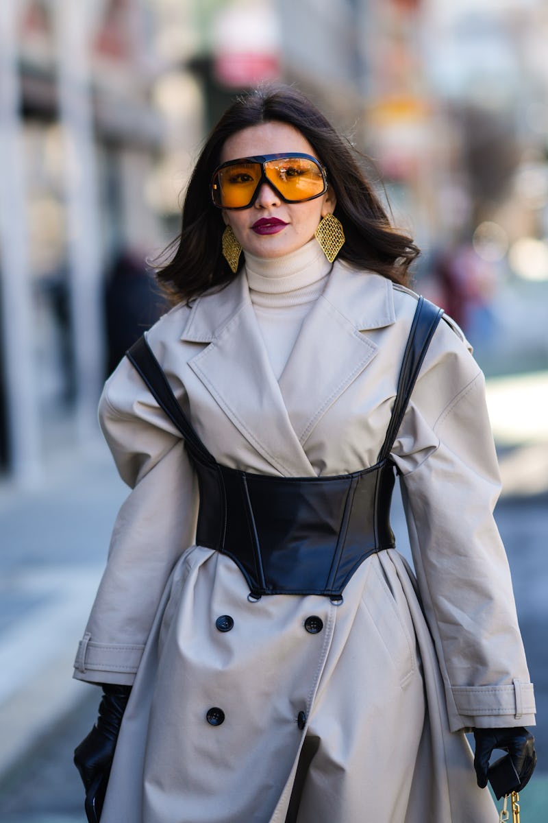 A woman wearing a trench coat