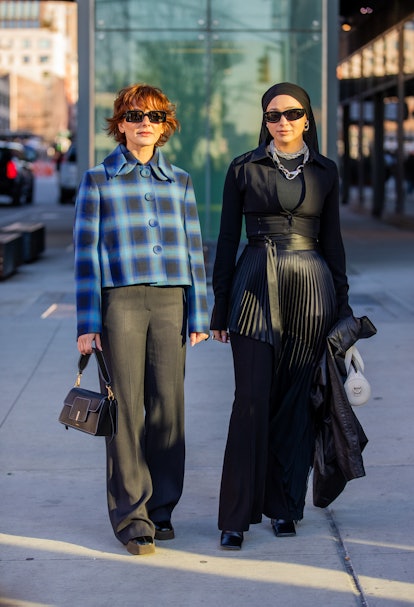 NEW YORK, NEW YORK - FEBRUARY 15: Alyssa Coscarelli seen wearing cropped blue checkered jacket, pant...