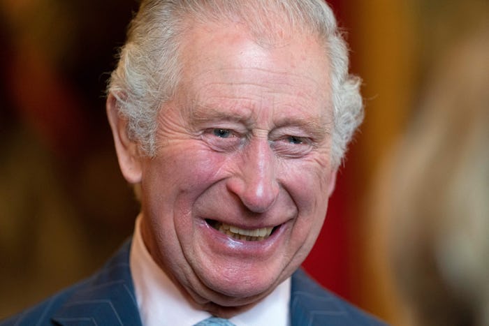 Britain's Prince Charles, Prince of Wales, smiles as he speaks to university representatives during ...