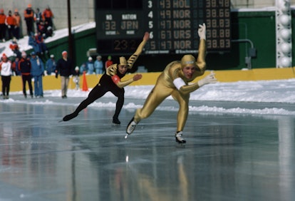 American speed skater Eric Heiden (in yellow) skates in a heat during the 1980 Winter Olympics at La...
