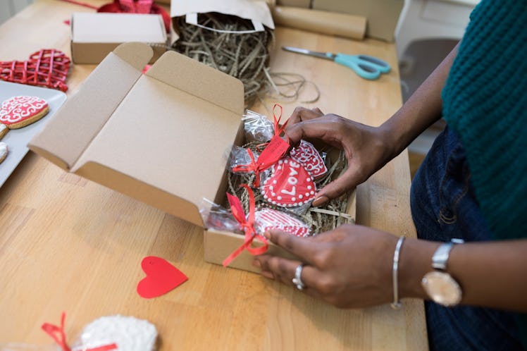 A woman makes a Valentine's Day craft after watching a Valentine's Day DIY TikTok video.