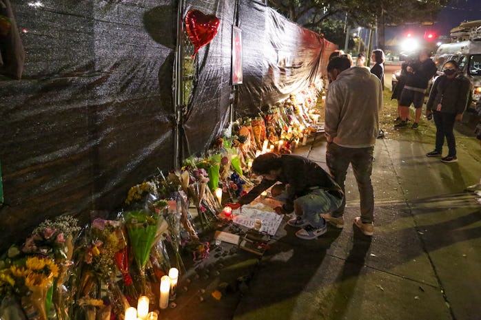 People attend a makeshift memorial on November 7, 2021 at the NRG Park grounds where eight people di...