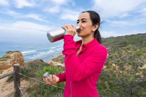 A woman hikes. Here’s your daily horoscope for February 23, 2022.