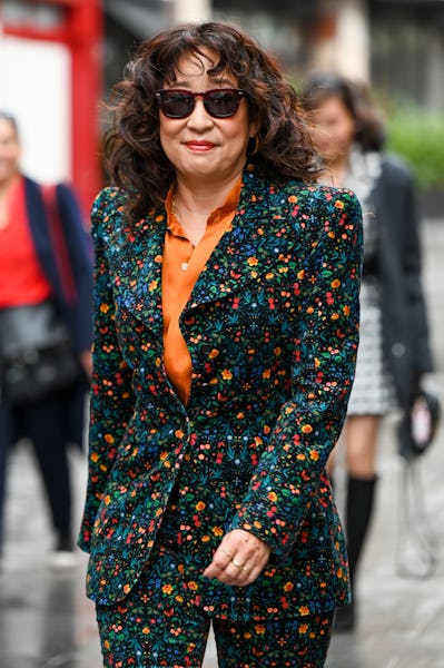 Sandra Oh wearing a floral outfit. 