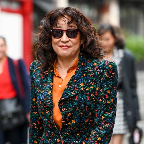 Sandra Oh wearing a floral outfit. 