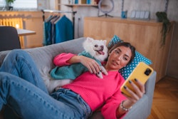 A young woman takes a selfie with her dog on the sofa. Can you tell if someone declines your DM on i...