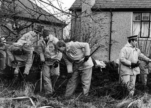 Police searching the ground behind the home of Peter Sutcliffe in Bradford following his arrest in 1...