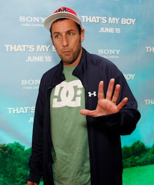 Boston, MA - Adam Sandler waves to the cameras as he quickly walks down the red carpet for the relea...