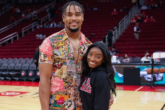 HOUSTON, TEXAS - DECEMBER 28: Simone Biles and Jonathan Owens attend a game between the Houston Rock...