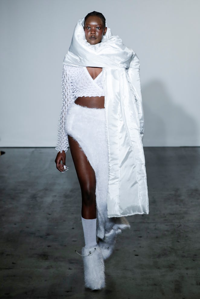 LONDON, ENGLAND - FEBRUARY 20: A model walks the runway for Chet Lo at the Fashion East show during ...