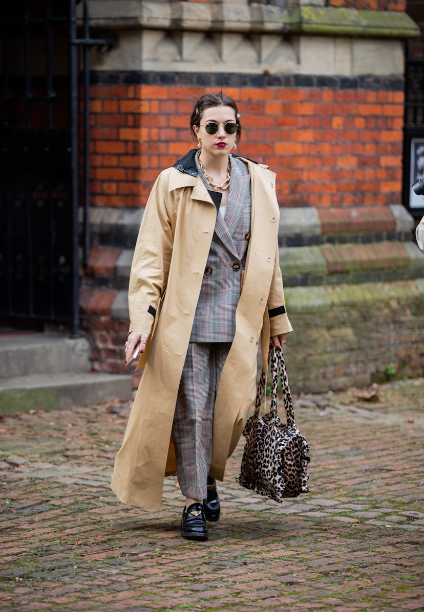 LONDON, ENGLAND - FEBRUARY 18: A guest is seen wearing beige trench coat outside Bora Aksu during Lo...