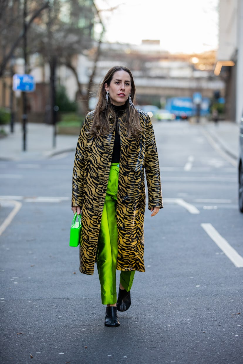 LONDON, ENGLAND - FEBRUARY 18: Idalia Salsamendi seen wearing coat with animal print, green pants, n...