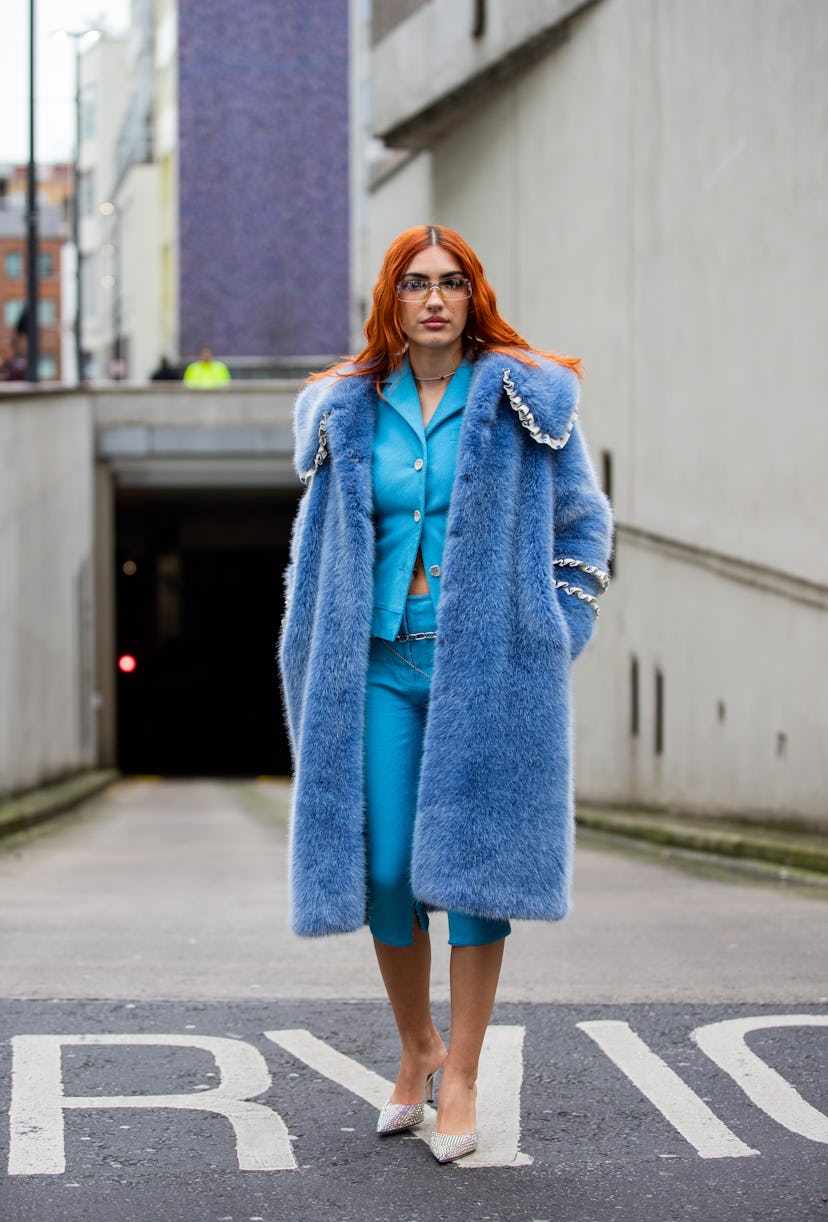 LONDON, ENGLAND - FEBRUARY 19: Patricia Manfield seen wearing blue teddy coat, cropped pants, blazer...
